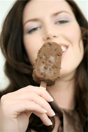 woman eating ice cream, portrait Stock Photo - Rights-Managed, Code: 853-02914676