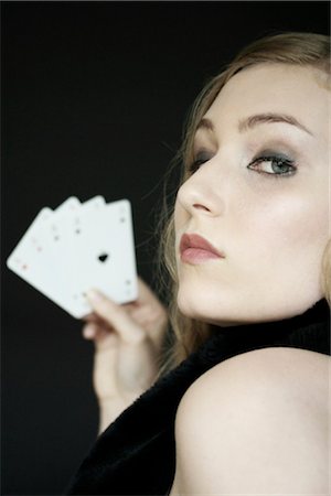 young woman holding playing cards Stock Photo - Rights-Managed, Code: 853-02913564