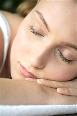 young woman lying on a bed Stock Photo - Rights-Managed, Code: 853-02913566