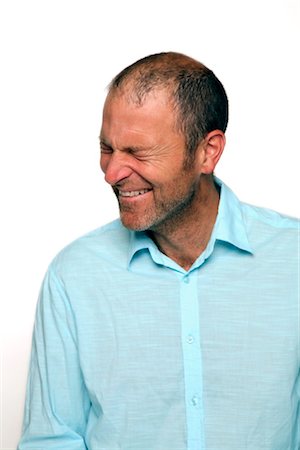 embarrassing - Man with blue shirt laughing Stock Photo - Rights-Managed, Code: 853-02913633