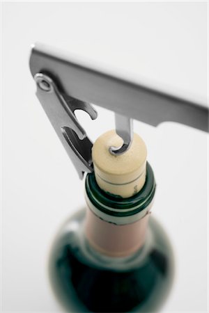 High angle view of corkscrew and bottle of wine Stock Photo - Rights-Managed, Code: 853-03227660