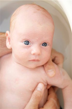 Man bathing baby, close-up Stock Photo - Rights-Managed, Code: 853-03227836