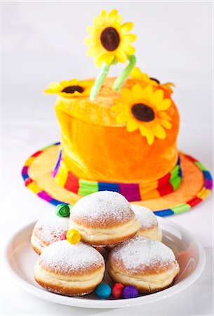 Doughnuts on a plate in front of a colourful hat, high angle view Stock Photo - Rights-Managed, Code: 853-03458966