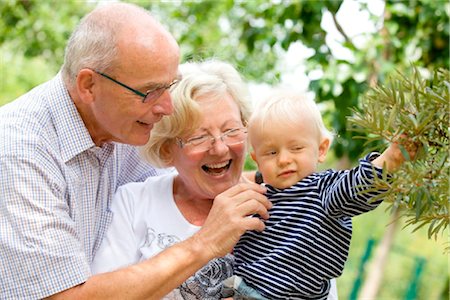 Grandparents with toddler in garden Stock Photo - Rights-Managed, Code: 853-03616899