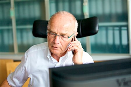simsearch:853-05523421,k - Senior man on cell phone in home office Stock Photo - Rights-Managed, Code: 853-03616935