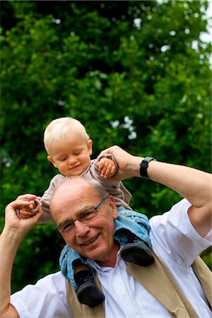 Grandfather carrying toddler on shoulders, portrait Stock Photo - Rights-Managed, Code: 853-03616959