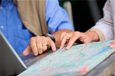 Senior couple with laptop and road map, close-up Stock Photo - Rights-Managed, Code: 853-03616990