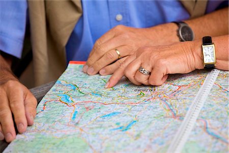 senior couple traveling - Senior couple looking in road map, close-up Stock Photo - Rights-Managed, Code: 853-03617027