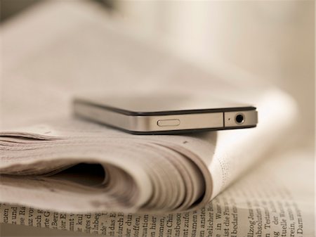 smart phone from above - Smartphone and newspaper Stock Photo - Rights-Managed, Code: 853-03776334