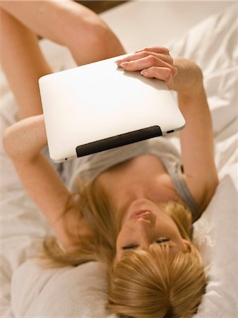 simsearch:853-06441524,k - Young woman with Tablet PC in  bed Stock Photo - Rights-Managed, Code: 853-03776339