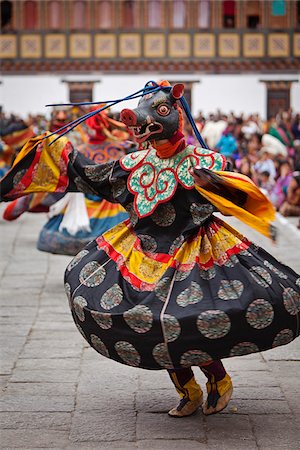 Masked dancing at Trashi Chhoe Dzong, a monastery now also housing the secretariat, the throne room and offices of the King. Stock Photo - Rights-Managed, Code: 862-05996911