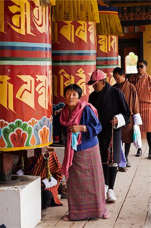 simsearch:862-05997061,k - Turning the giant prayer wheels at the National Memorial Chorten in Thimphu. Stock Photo - Rights-Managed, Code: 862-05996924