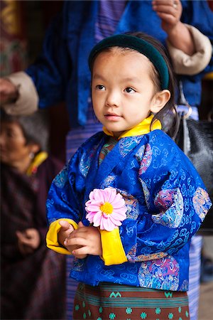 simsearch:862-05996924,k - Young girl at the National Memorial Chorten, which was built in the Tibetan style in 1974 to honour the third king of Bhutan. Foto de stock - Con derechos protegidos, Código: 862-05996923