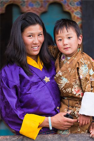 A mother and her son enjoying the Tamshingphala Choepa festival in Bumthang. Stock Photo - Rights-Managed, Code: 862-05996988