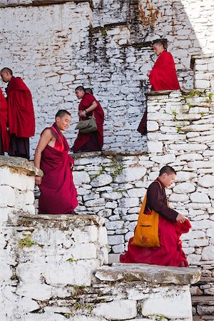 Monks at Kurjey Lhakhang, the final resting place of the remains of the first three kings of Bhutan. Stock Photo - Rights-Managed, Code: 862-05997000