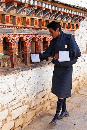 simsearch:862-05997030,k - Turning the prayer wheels at Ura Lhakhang. Stock Photo - Rights-Managed, Code: 862-05997017