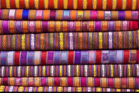 simsearch:862-05997049,k - Bhutanese fabrics stacked up in a shop, Thimphu. Stock Photo - Rights-Managed, Code: 862-05997047