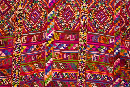 fabric clothing pattern - A stunning piece of woven material, to be used for a lady's traditional kira, the national dress for Bhutanese women. Stock Photo - Rights-Managed, Code: 862-05997053