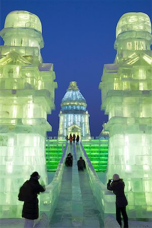 China, Heilongjiang Province, Harbin. Children slide down and ice chute at the Harbin Ice and Snow Festival. Stock Photo - Rights-Managed, Code: 862-05997241