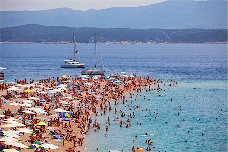 sun bather - Croatia, Brac Island, Central Europe. Bathers at Zlatni Rat beach in Bol Stock Photo - Rights-Managed, Code: 862-05997312