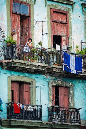 The Caribbean, West Indies, Cuba, Central Havana, woman on building balcony Stock Photo - Rights-Managed, Code: 862-05997387
