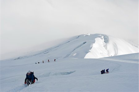 person climbing a volcano - South America, Ecuador, Volcan Cotopaxi (5897m), highest active volcano in the world, climbers roped up on the mountain Stock Photo - Rights-Managed, Code: 862-05997488