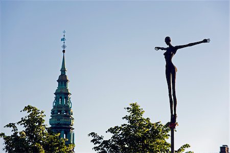 spire - Europe, Scandinavia, Denmark, North Zealand Copenhagen; modern art statue and church spire Stock Photo - Rights-Managed, Code: 862-05997482
