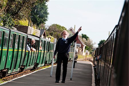 sight seeing in england - Station master at Romney Sands station, Romney, Hythe and Dymchurch Railway, Kent, UK Stock Photo - Rights-Managed, Code: 862-05997508