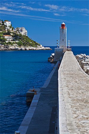 Nice,Provence-Alpes-Cote d'Azur, France. Quai Wall and Nice Harbour lighthouse Stock Photo - Rights-Managed, Code: 862-05997649