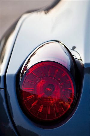 plastic not people - La Fontonne, Antibes, Provence Alpes Cote d'Azur, France. Tail light of luxury supercar Ferrari California Stock Photo - Rights-Managed, Code: 862-05997670