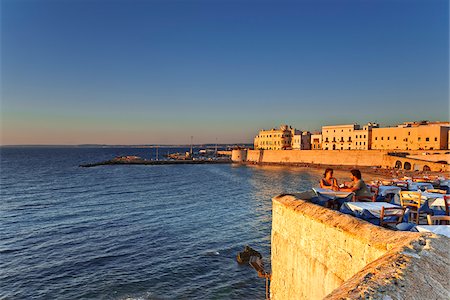 dinner in water - Italy, Apulia, Lecce district, Salentine Peninsula, Salento, Gallipoli. Stock Photo - Rights-Managed, Code: 862-05997925