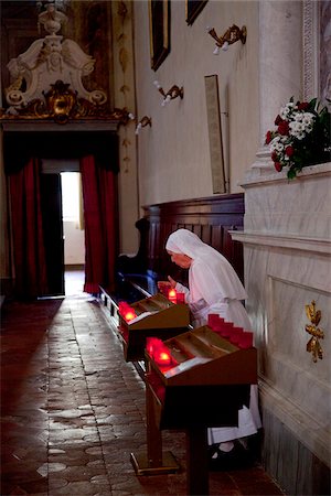 seniors in church - Italy, Tuscany, Lucca. A nun in one of the churches of the city Stock Photo - Rights-Managed, Code: 862-05997926