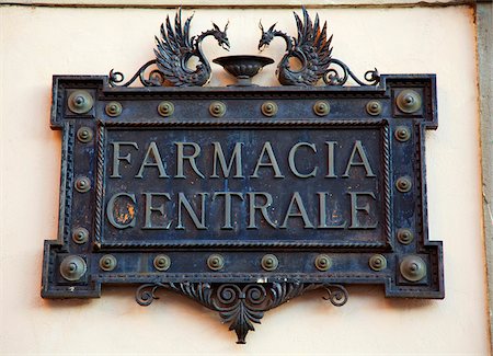 simsearch:862-05997928,k - Italy, Tuscany, Lucca. An ornamented sign for a pharmacy Stock Photo - Rights-Managed, Code: 862-05997975