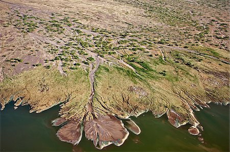 Numerous shallow seasonal river courses drain into Lake Logipi, an alkaline lake situated in the low-lying, inhospitable Suguta Valley. Stock Photo - Rights-Managed, Code: 862-05998436