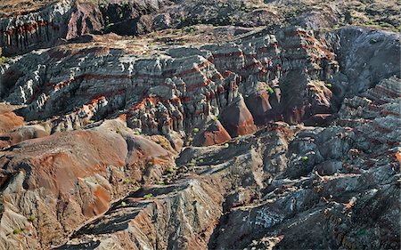 The beautiful colours of volcanic lava rocks and layers of successive ancient eruptions in the Samburu Hills, in northern Kenya Stock Photo - Rights-Managed, Code: 862-05998432