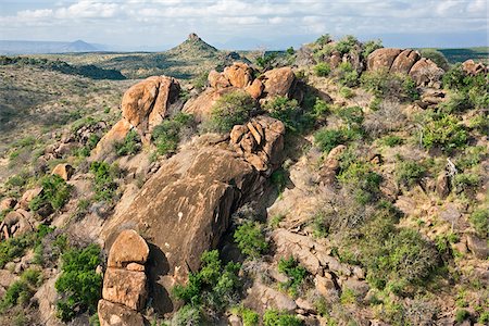 Ancient inselbergs and bare rock outcrops of varying dimensions are a feature of the semi-arid regions of Samburu District. Stock Photo - Rights-Managed, Code: 862-05998468