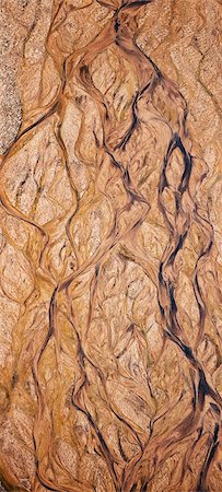 As seasonal rivers in Samburu District dry soon after the end of the rainy season, leaving interesting patterns in the sand of the Seiya. Stock Photo - Rights-Managed, Code: 862-05998469