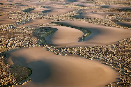 simsearch:862-05998435,k - Barchan dunes in the hospitable, low-lying Suguta Valley of northern Kenya. Stock Photo - Rights-Managed, Code: 862-05998461