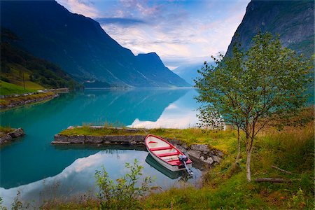 fiordo - Norway, Western Fjords, Nordfjord, rowing boat in lake at dusk Fotografie stock - Rights-Managed, Codice: 862-05998735