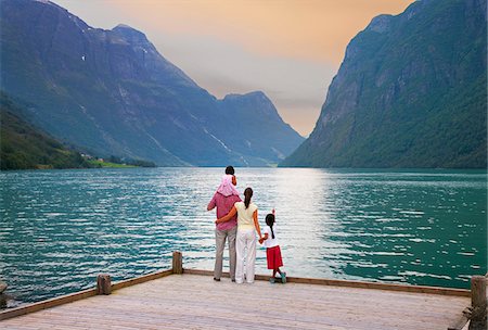 family on pier - Norway, Western Fjords, Nordfjord, Family standing on jetty at dusk (MR) Stock Photo - Rights-Managed, Code: 862-05998738