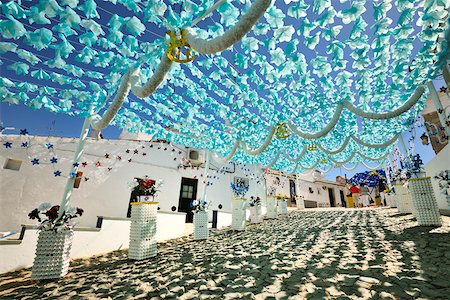 Streets decorated with paper flowers. People festivities (Festas do Povo). Campo Maior, Portugal Stock Photo - Rights-Managed, Code: 862-05998849