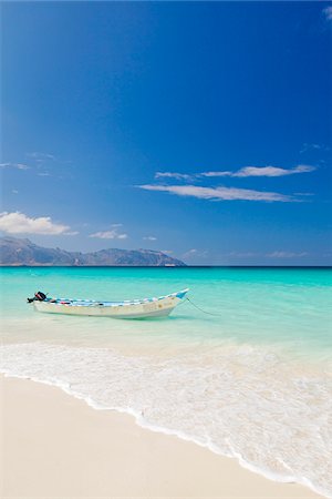 Yemen, Socotra, Sha'ab. A boat moored in the sea at Sha'ab. Stock Photo - Rights-Managed, Code: 862-05999707