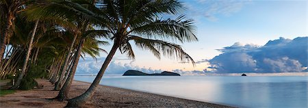 simsearch:862-06542597,k - Australia, Queensland, Cairns.  Palm Cove beach at dawn with Double Island in background. Stock Photo - Rights-Managed, Code: 862-06540762