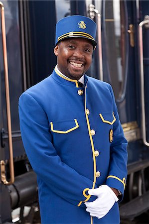 railway uniforms - A steward on the Venice Simplon Orient Express train, Innsbruck, Austria Stock Photo - Rights-Managed, Code: 862-06540773