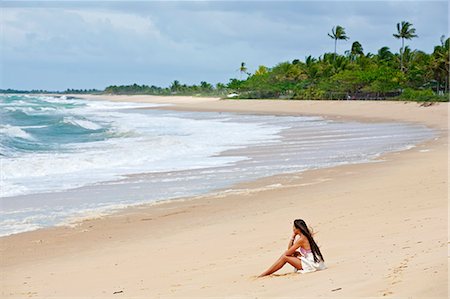 Brazil, Bahia, Caraiva, Caraiva beach, model on the beach wearing a raw cotton beach dress. MR Stock Photo - Rights-Managed, Code: 862-06540797