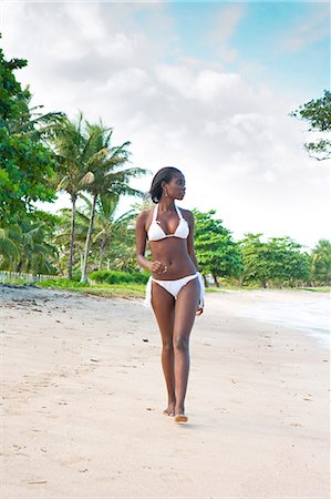 South America, Brazil, Bahia, a black Brazilian model in a bikini woman walks along a beach on Itaparica island in the Baia de Todos os Santos MR Stock Photo - Rights-Managed, Code: 862-06540886