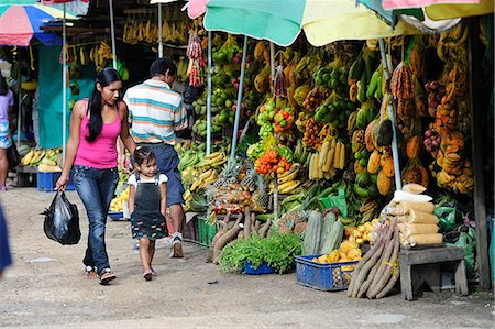 family at market - South America, Colombia, Leticia, Amazon region, Woman walking in a market with her daughter Stock Photo - Rights-Managed, Code: 862-06541021