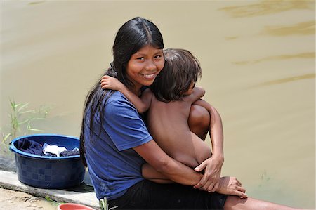 Mother and child at the Amacayon Indian Village, Amazon river, Puerto Narino, Colombia Stock Photo - Rights-Managed, Code: 862-06541033