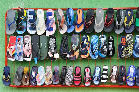 shoes lined up in a row - Flip flops for sale at a Indian market in Silvia, Guambiano Indians, Colombia, South America Stock Photo - Rights-Managed, Code: 862-06541095