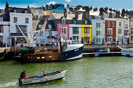 fishing boats uk - Weymouth, Dorset, UK. The Harbour authority patrols in Weymouths busy harbour. Stock Photo - Rights-Managed, Code: 862-06541400